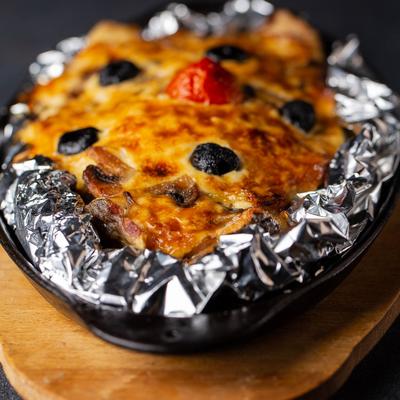 Trout baked in foil with vegetables